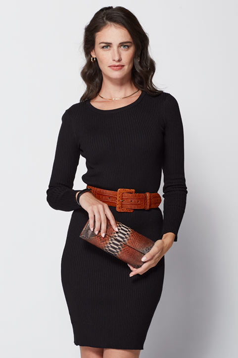 Female model wearing Glazed Alligator Belt with Covered Buckle holding Python Classic Clutch Handbag